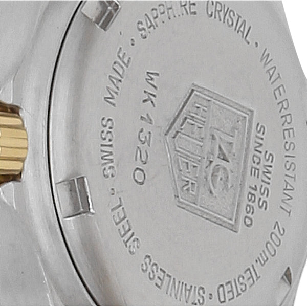 Reloj Tag Heuer para dama modelo Professional bisel en oro amarillo 18 kilates.