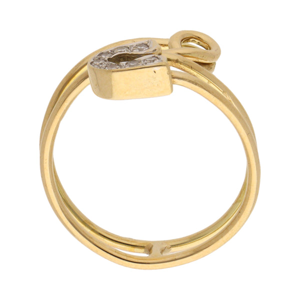 Anillo tubular motivo seguro para ropa con diamantes en oro dos tonos 18 kilates.