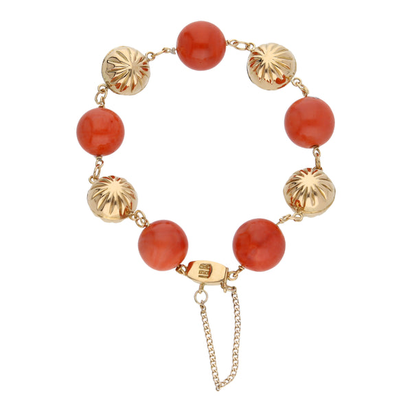 Pulsera eslabón combinado con coral en oro amarillo 18 kilates.