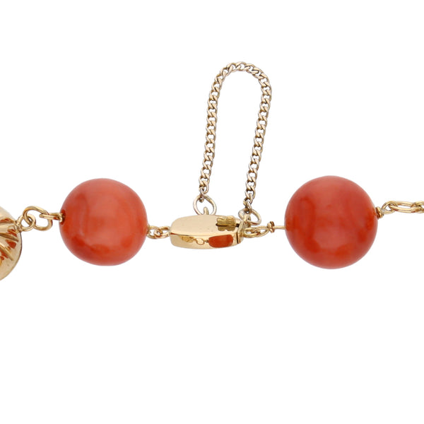 Pulsera eslabón combinado con coral en oro amarillo 18 kilates.