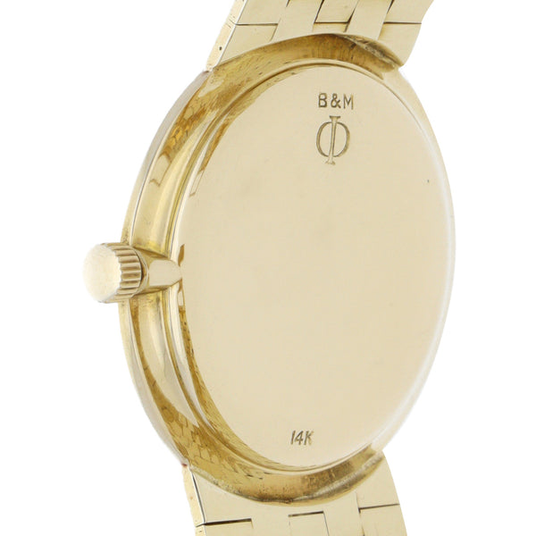 Reloj Baume & Mercier para caballero en oro amarillo 14 kilates.