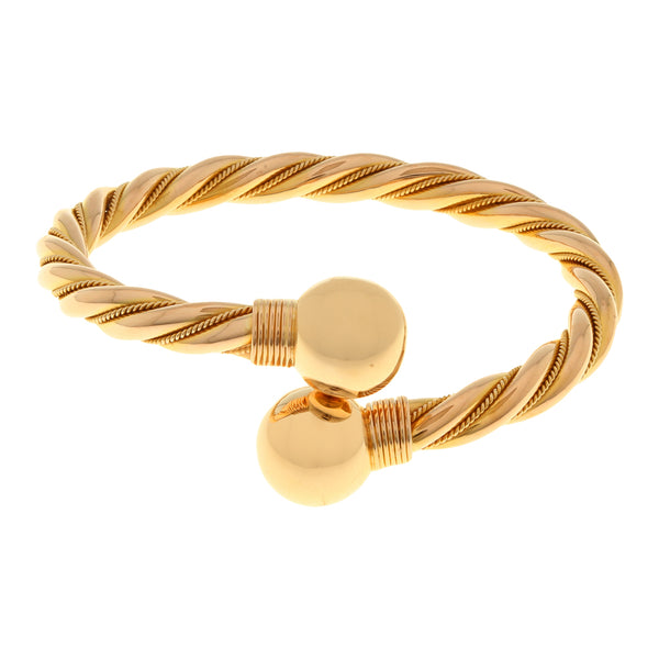 Pulsera estilizada abierta en oro amarillo 18 kilates.