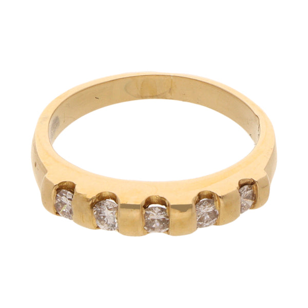 Anillo estilizado con diamantes en oro amarillo 18 kilates.