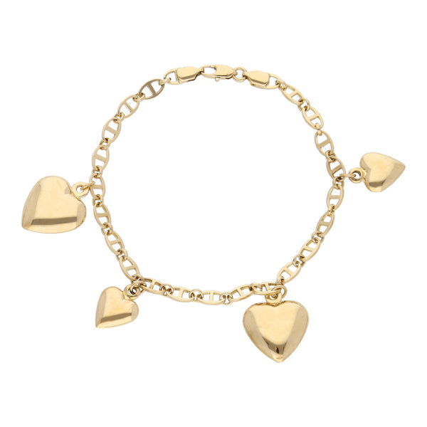 Pulsera eslabón combinado con cuatro dijes motivo corazón en oro amarillo 18 kilates.