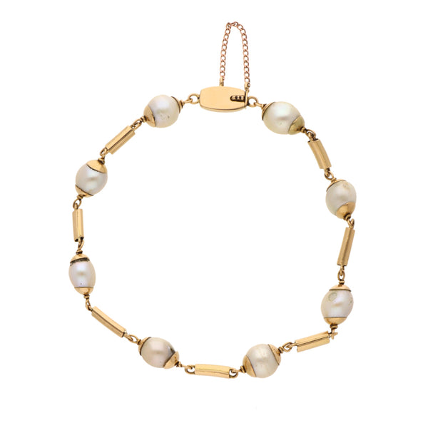 Pulsera eslabón combinado con perlas en oro amarillo 18 kilates.