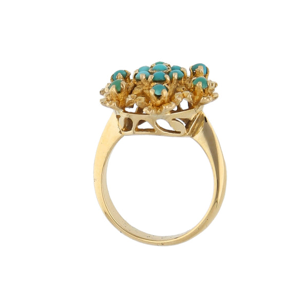 Anillo calado motivo floral con turquesas en oro amarillo 18 kilates.