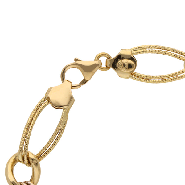 Pulsera eslabón combinado en oro dos tonos 18 kilates.