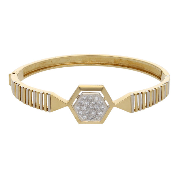 Pulsera de arillo ovalada articulada con diamantes en oro dos tonos 18 kilates.