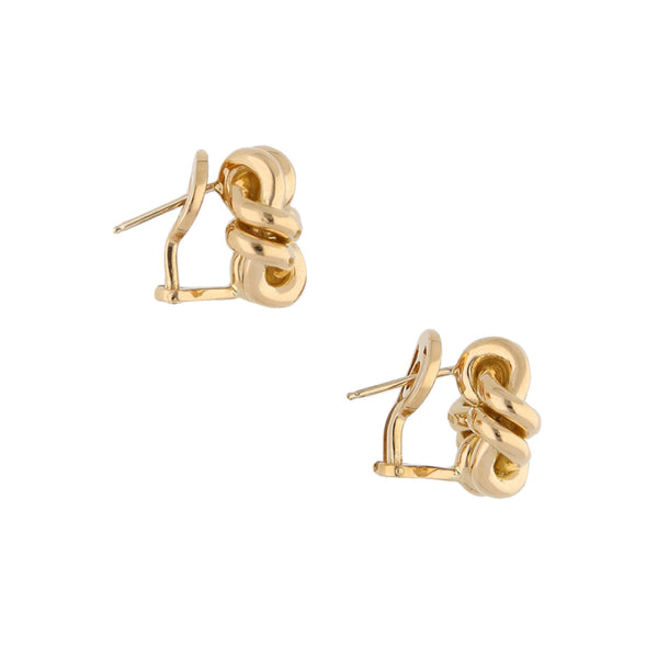 Aretes estilizados firma Tane en oro amarillo 18 kilates.