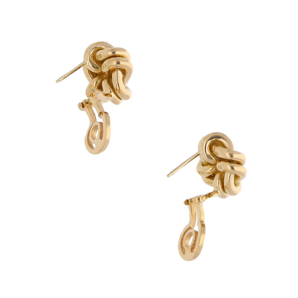 Aretes estilizados firma Tane en oro amarillo 18 kilates.