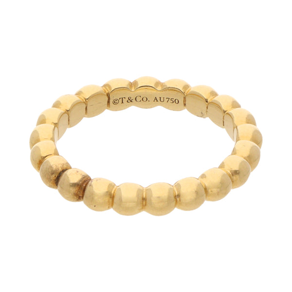 Argolla boleada firma Tiffany & Co. en oro amarillo 18 kilates.