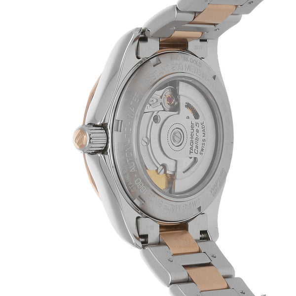 Reloj Tag Heuer para dama modelo Aquaracer vistas en oro rosa 18 kilates.