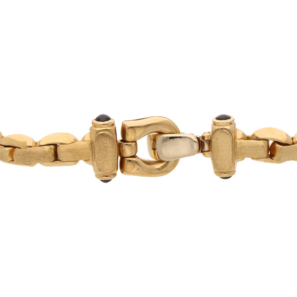 Pulsera eslabón articulado con sintéticos en oro amarillo 14 kilates.