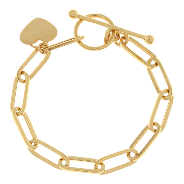 Pulsera eslabón cruzado con dije motivo corazón en oro amarillo 14 kilates.