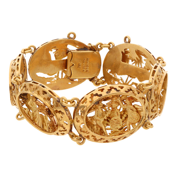 Pulsera eslabón articulado calado motivo escenas prehispánicas en oro amarillo 18 kilates.