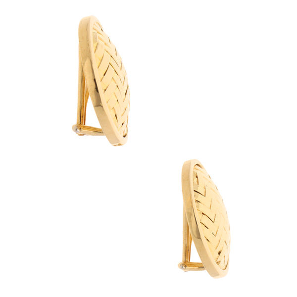 Aretes huecos firma Tiffany & Co. en oro amarillo 18 kilates.