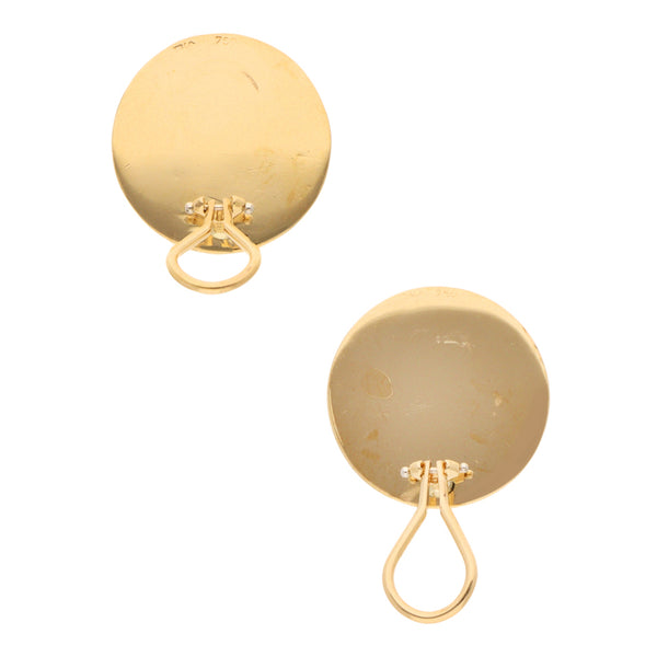 Aretes huecos firma Tiffany & Co. en oro amarillo 18 kilates.