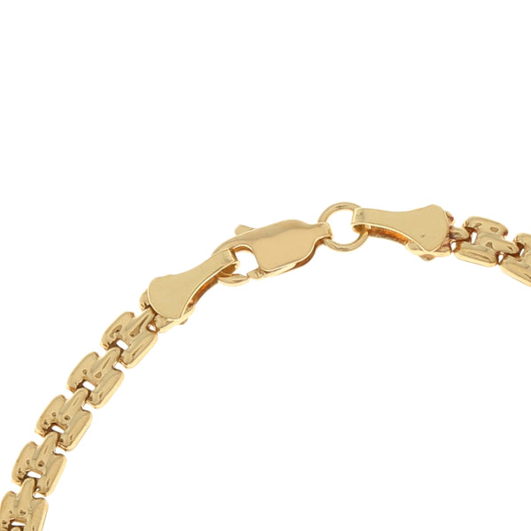 Pulsera eslabón articulado con aplicación motivo corazón en oro amarillo 14 kilates.