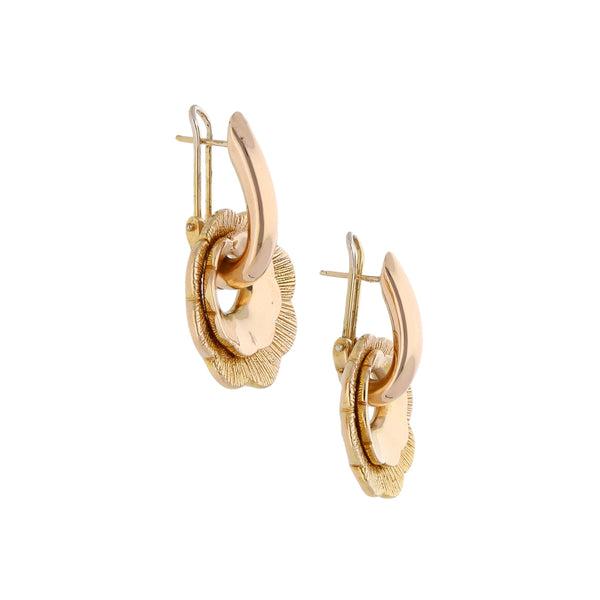 Aretes diseño italiano motivo flor en oro dos tonos 14 kilates.