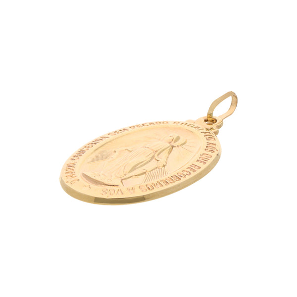 Medalla diseño especial en oro amarillo 14 kilates.