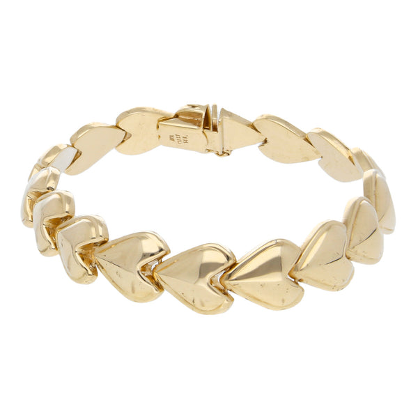 Pulsera eslabón articulado motivo corazones en oro amarillo 14 kilates.