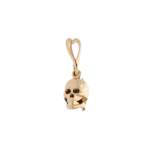 Dije hueco motivo calavera en oro amarillo 14 kilates.