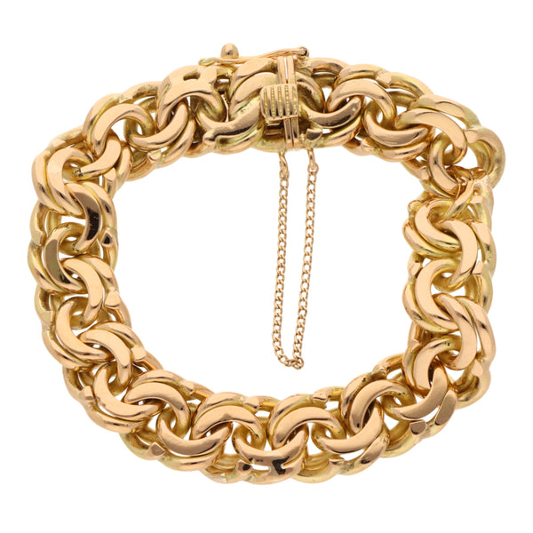 Pulsera eslabón cruzado doble en oro amarillo 18 kilates.