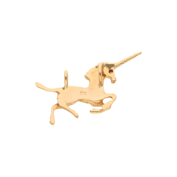 Dije diseño especial motivo unicornio con diamante en oro amarillo 18 kilates.