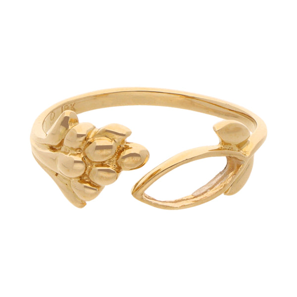 Anillo abierto motivo floral en oro amarillo 18 kilates.