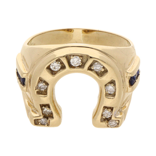 Anillo diseño especial motivo herradura con diamantes y sintéticos en oro amarillo 14 kilates.