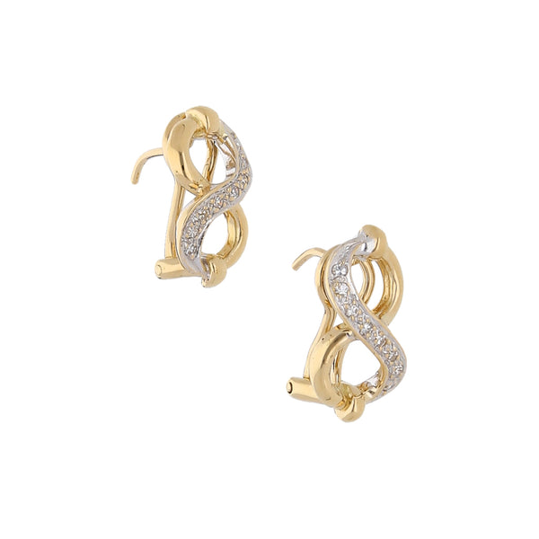 Aretes estilizados con diamantes en oro dos tonos 18 kilates.