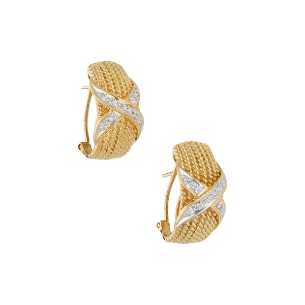 Aretes estilizados con diamantes en oro amarillo 18 kilates.