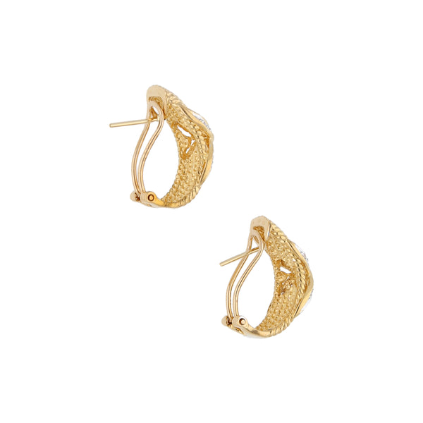 Aretes estilizados con diamantes en oro amarillo 18 kilates.