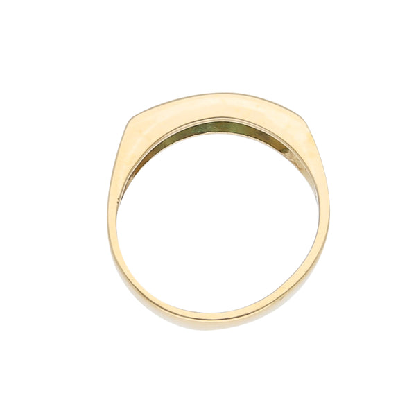 Anillo estilizado con esmeraldas en oro amarillo 18 kilates.