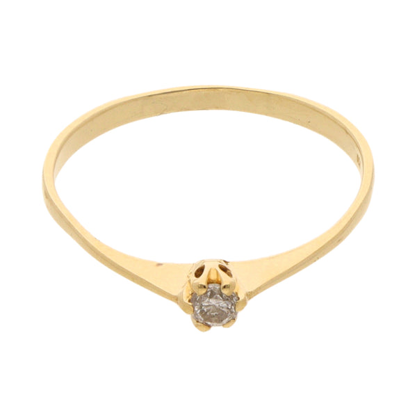 Anillo solitario con diamante en oro amarillo 18 kilates.