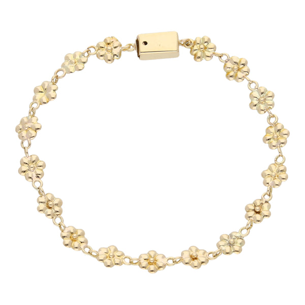 Pulsera eslabón laminado motivo floral en oro amarillo 18 kilates.