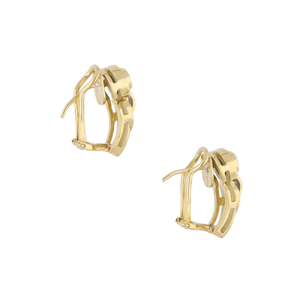 Aretes estilizados con zafiros y diamantes en oro amarillo 18 kilates.