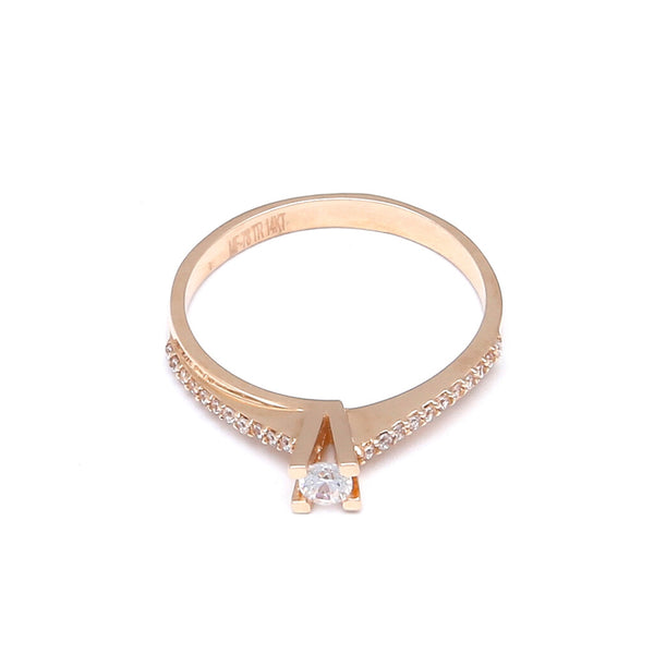 Anillo estilizado con circonias oro rosa 14 kilates.