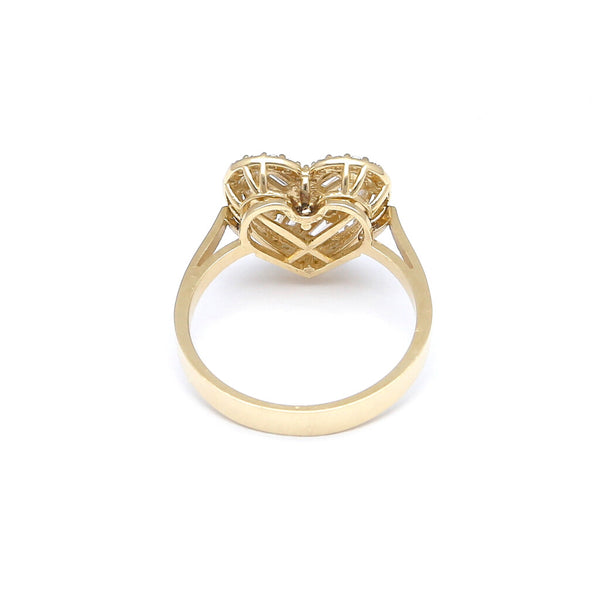 Anillo calado motivo corazón con circonias en oro amarillo 14 kilates.