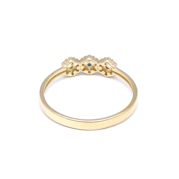 Anillo estilizado con sintéticos motivo floral en oro amarillo 14 kilates.