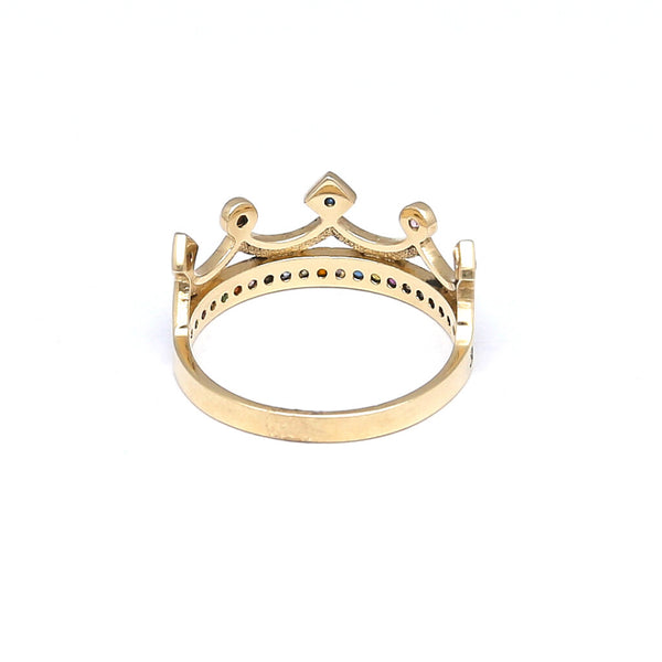 Anillo diseño especial motivo corona con sintéticos en oro amarillo 14 kilates.