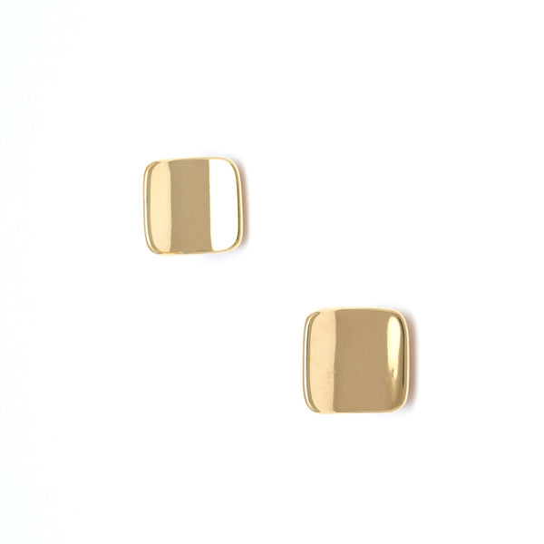 Aretes huecos ondulados en oro amarillo 14 kilates.