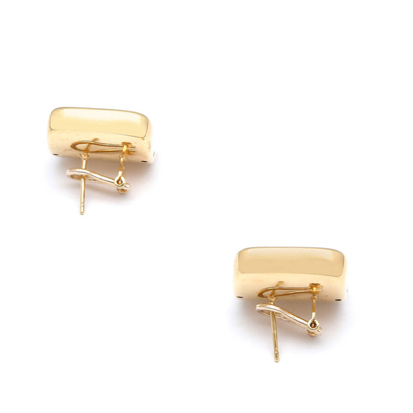 Aretes huecos ondulados en oro amarillo 14 kilates.