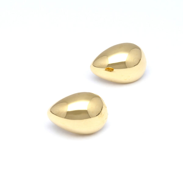 Aretes huecos motivo gota en oro amarillo 14 kilates.