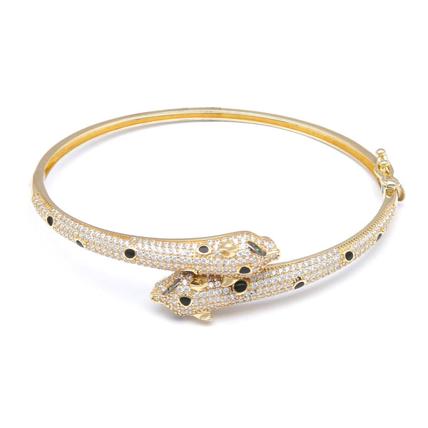 Pulsera de arillo ovalada articulada motivo felinos con circonias, sintéticos y esmalte en oro amarillo 14 kilates.