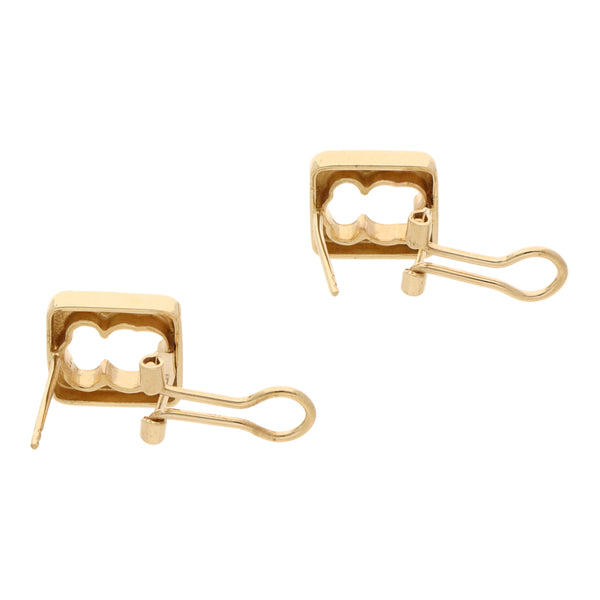 Aretes calados motivo oso en oro amarillo 14 kilates.