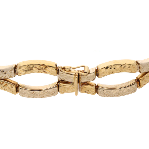 Pulsera eslabón articulado combinado en oro tres tonos 14 kilates.