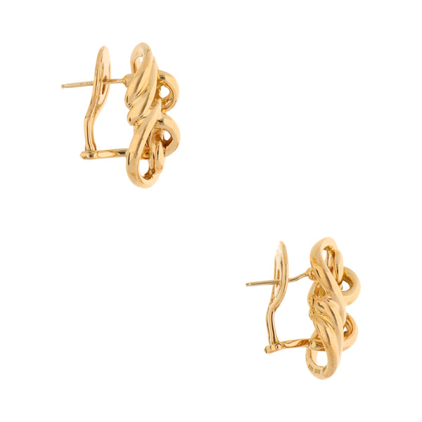 Aretes tubulares firma Tane en oro amarillo 18 kilates.