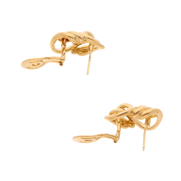 Aretes tubulares firma Tane en oro amarillo 18 kilates.