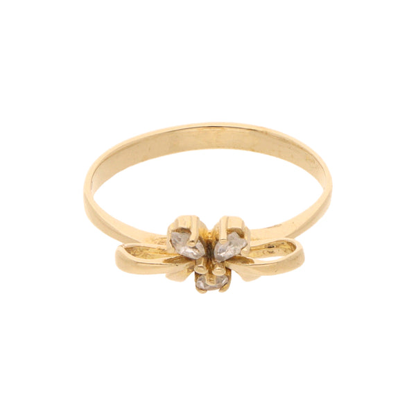 Anillo liso motivo moño con circonias en oro amarillo 14 kilates.